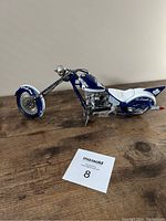 Side view of 12-inch Toronto Maple Leafs motorcycle model showing blue and white color scheme with chrome engine detail