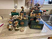 Boyds Bears collection figurines displayed on countertop with original boxes