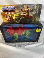Front view of the vintage Masters of The Universe Battle Cat action figure in unopened blister box packaging, showing the figure with green and yellow stripes and red armor.