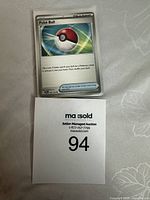 Single Trainer Poke Ball card displayed used condition