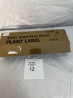 Box of 25 stainless steel plant labels made from 304L stainless steel, unopened and new condition.