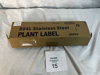 Closed box of 25 pieces of 304L stainless steel plant labels showing brand and quantity information on box.