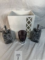 Full set showing two soap dispensers, toothbrush holder, and white waste bin on a white background.