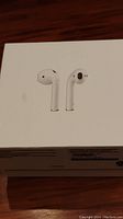 Closed box showing AirPods image on the front.