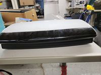 Side view of the Bose Media Center showing the white top and black front edge.