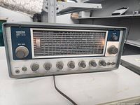 Full front view of the Lafayette Communications Receiver Model HA-225 showing main tuning knob, analog frequency display with multiple bands, and various control knobs.