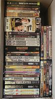 Stack of DVD cases showing various Western movie titles including American Outlaws, Gene Autry, God’s Gun, Bonanza, and others.