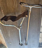 Overall view showing metal frame with leather seat and handle