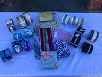 Overview of fabric swatches and rolls laid out on white table