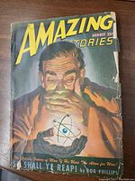 Front cover of the 1947 Amazing Stories comic book featuring an illustration of a man holding an atom symbol and the title with date August 25¢.