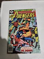 Front cover of Avengers No. 156 comic showing artwork of Avengers characters fighting Dr. Doom.