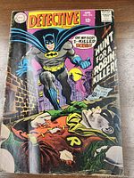 Front cover photo showing Batman and Robin with comic issue details, indicating 1968 edition, lower grade condition.