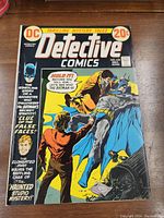 Front cover of Detective Comics No. 430 from 1972 showing Batman and a man in red jacket in action pose with bright yellow background