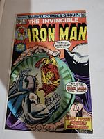 Full cover image of Iron Man No. 75 comic book showing Iron Man and the Black Lama in combat on the cover with relevant text and issue number visible.