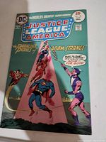 Front cover of the Justice League of America No. 120 comic book showing superheroes in action with vivid colors.