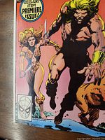 Close-up of the comic front cover showing the main characters and the Premiere Issue label.