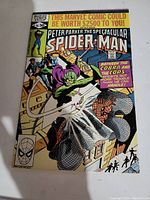 Front cover of the comic book showing Spider-Man and the villain Cobra in a dynamic scene with text highlighting storyline and Marvel branding.