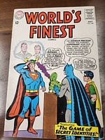 Front cover of World's Finest Comics issue 149, May 1965, showing Superman, Batman, and Robin with headline 'The Game of Secret Identities!'