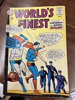 Front cover of World's Finest Comics No. 148 showing Superman and Batman flying with police below, comic book priced at 12 cents and dated 1965.