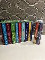 Photo showing 10 colorful hardcover books in The Terrific Ten Mega-Massive Box Set by David Walliams lined up inside the box set with titles visible.