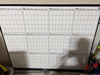 Front view showing the entire whiteboard with multiple monthly calendar grids.