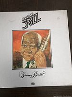 Album cover with painted portrait of Sidney Bechet holding a clarinet, titled Giants of Jazz