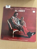 Front cover of the vintage vinyl LP showing Al Hirt sitting in a chair holding a trumpet, album title and artist name visible.
