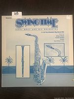 Front cover of Swingtime LP showing instrument illustrations and title.