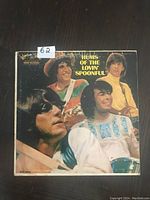 Front cover of vintage LP 'Hums of the Lovin' Spoonful' showing the four band members and album title.