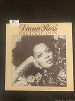 Front cover of Diana Ross Greatest Hits vintage LP with black and white photo of Diana Ross and title text.