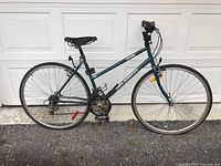Side view of the full bicycle showing frame, tires, pedals, seat, and handlebars.
