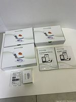 Three sealed Dexcom G6 sensor pack boxes, one transmitter box, one overpatch pack, two quick start guide pamphlets
