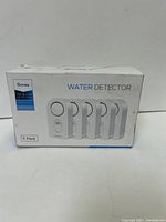 Front view of the white box showing the GoveeLife Water Detector 5 pack with image of 5 detectors and key branding.