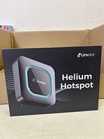 Front of Linxdot Helium Hotspot retail box showing sealed packaging and branding.