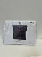 Front view of the MF-11 keyboard case packaging showing the product image and name.