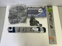 Photo showing four different chainsaw-related parts: a bag of metal chain links, a boxed Glarks chainsaw chain, a Stihl chainsaw chain in packaging, and a Stihl chainsaw guide bar in packaging.