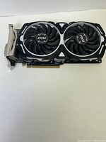 Top side view of MSI graphics card showing dual fans and metal heat sink.