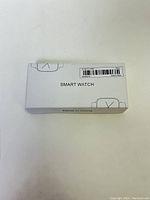 Front side of the white rectangular box with 'SMART WATCH' printed on it