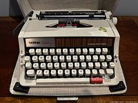 Front view of Brother Echelon 89 typewriter in open carrying case showing full keyboard and machine.