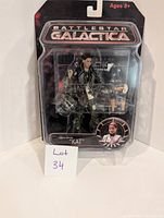 Front view of the Battlestar Galactica Lieutenant Kat action figure in sealed packaging showing figure and accessories.