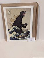 Godzilla art print in cardboard backing showing full artwork and Japanese text.