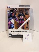 Front view of the Overwatch Lucio figure in original packaging showing figure and included accessories.
