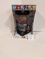 Front view of the Jelly Belly Mickey Mouse vending machine in packaging, showing clear globe filled with jelly beans and small Mickey Mouse figurine on base.