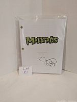 Front cover of Mallrats script in clear plastic sleeve, showing title in green and signature at bottom