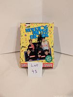 Front of the box showing colorful artwork and member photos with band names and 'Hot New Pix!' circle