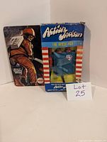 Image of vintage Mego Action Jackson Fire Rescue Pack in original box with vintage firefighter artwork and accessory visible through window.