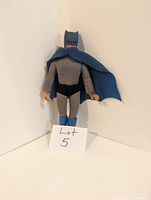 Front view of vintage Mego Batman figure standing against a white background with a note labeled 'Lot 5'.