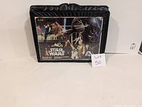 Front view of the black soft carrying case with clear front panel showing Star Wars characters and logo.