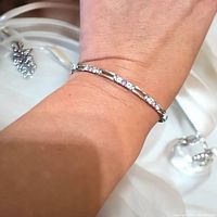 Photo showing the bracelet worn on wrist highlighting the amethyst and clear stones set in sterling silver