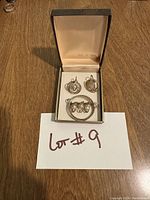 Photo of the 14k gold filled pearl earrings and brooch set in a box with beige satin interior.